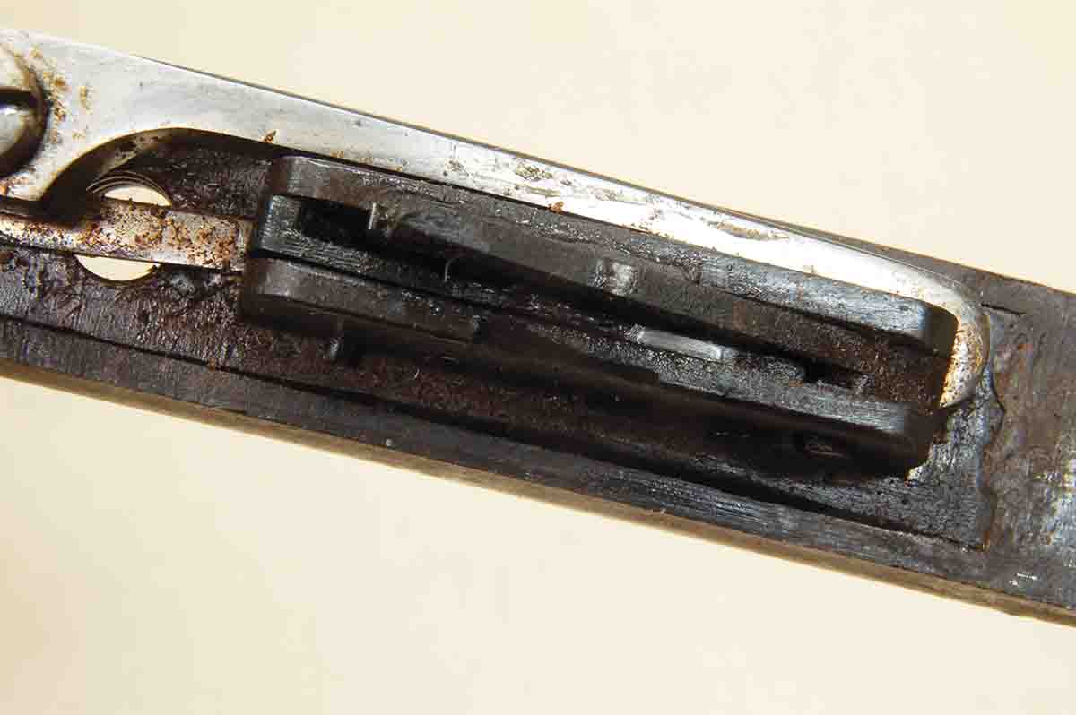 Looking into the top of a set trigger box shows debris that has accumulated, causing failure to set.